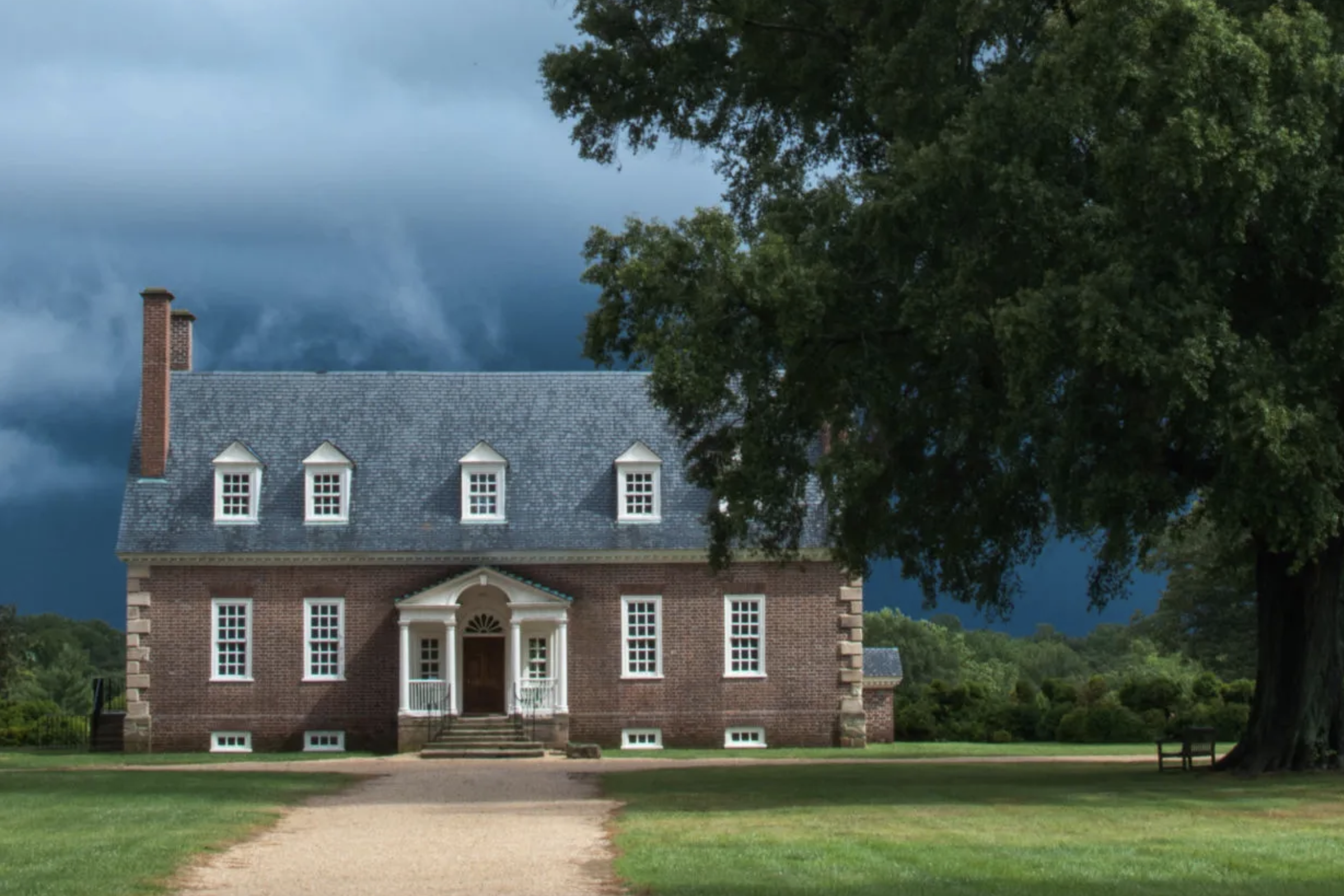 This is a modern photograph of George Mason's Gunston Hall, an elegant 1 1/2 story brick plantation house.